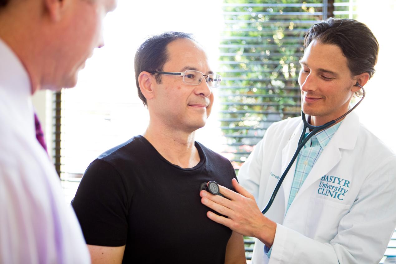 person getting heart listened to at clinic