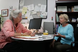 sharon hanson and standish sitting at a table