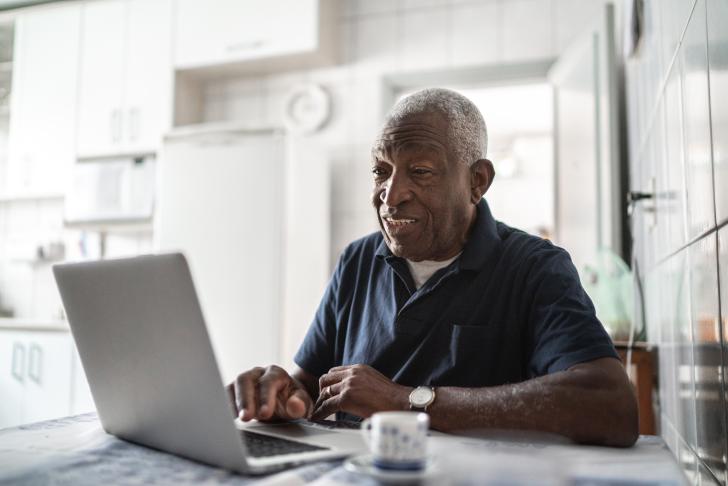 elderly man on laptop
