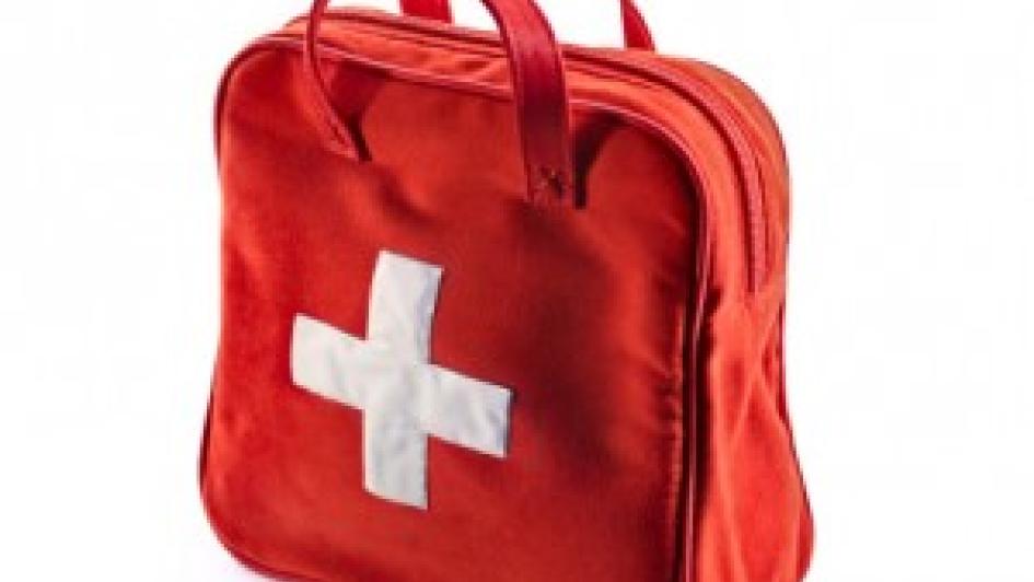 red bag with white first aid cross