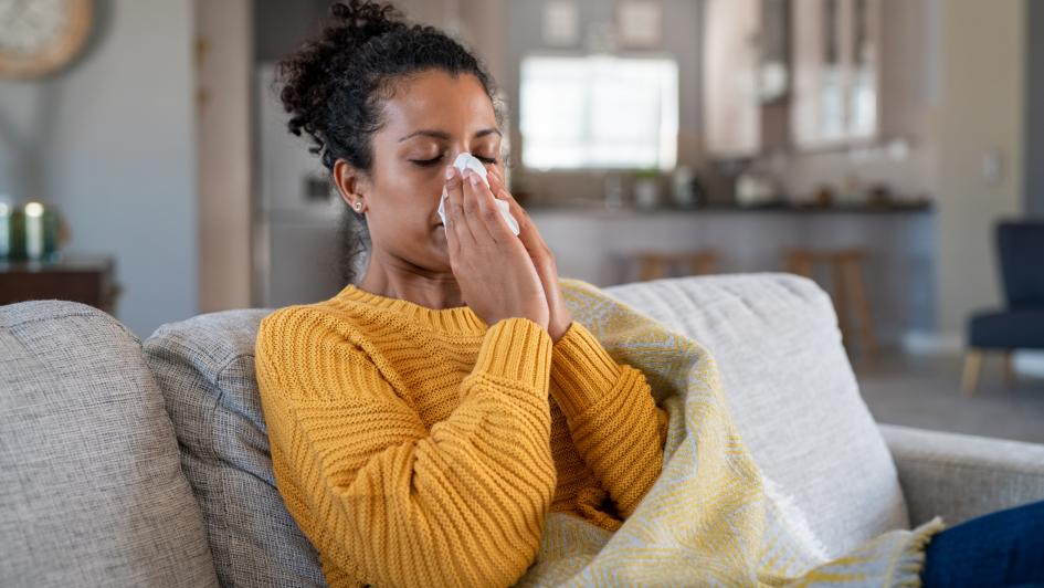 woman blowing her nose