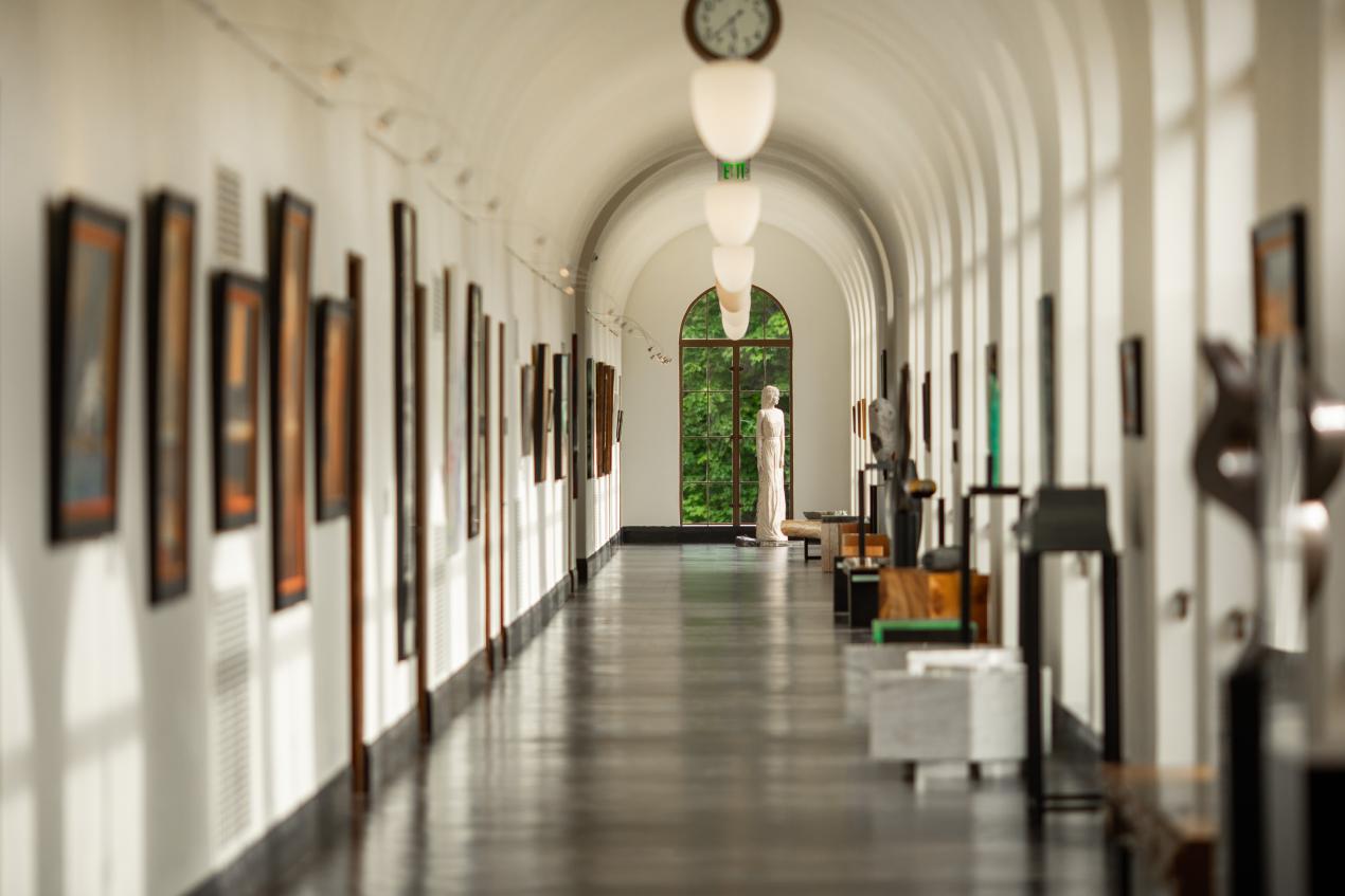 hallway with art hanging on walls