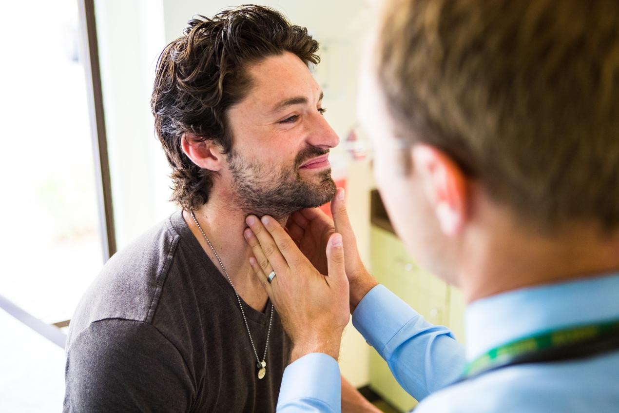 person getting throat examined