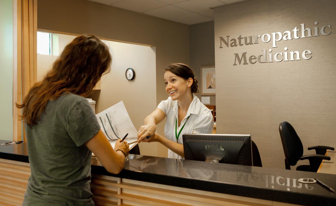 person at front desk of Naturopathic Medicine clinic